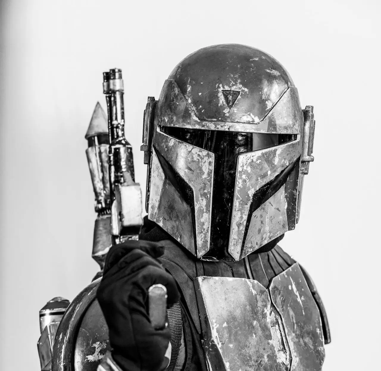 a man in a boba fett costume holding a gun